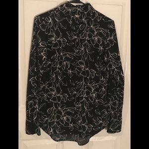 White outlines roses on black blouse